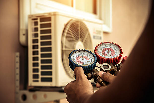 Professional Hvac technician working in Hensley, AR